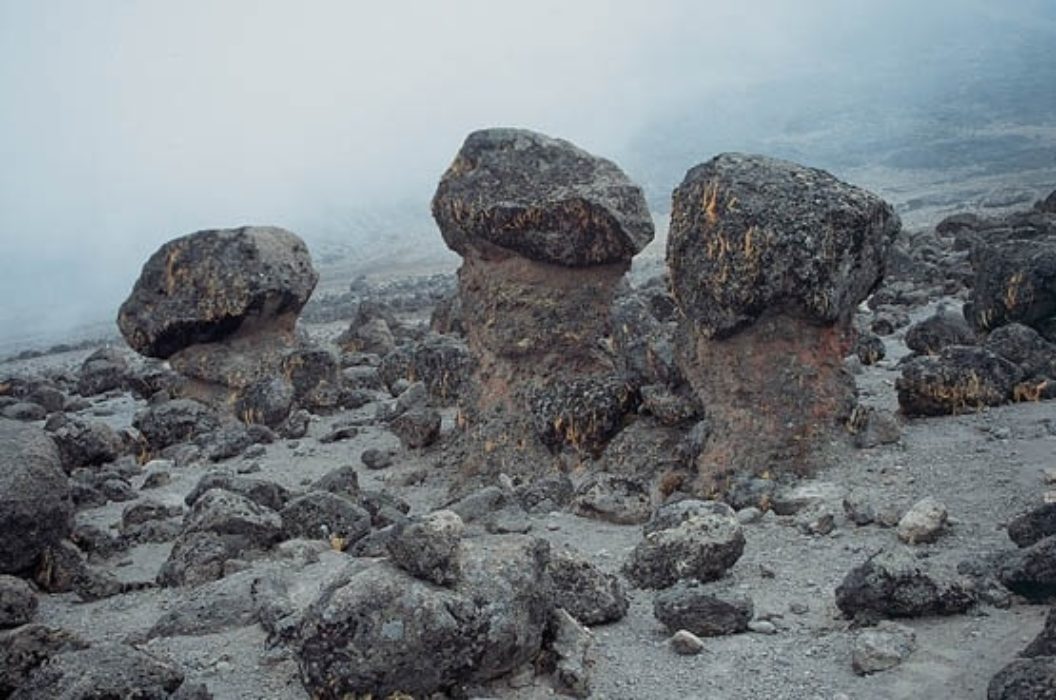 081 Strange Highland Desert Sculptures Boulders Perched On Plinth Of Mud And Pebbles