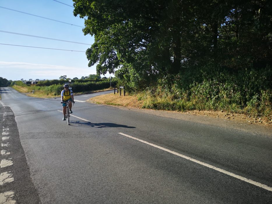 I stopped a random person to take this photo of me cycling on the wrong side of the road. Excellent.