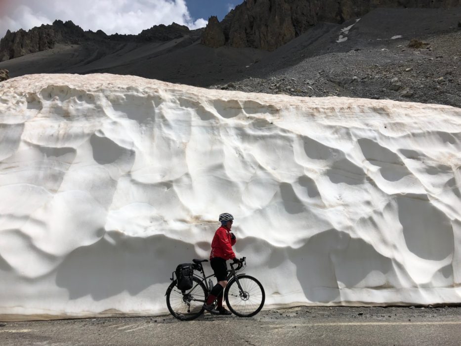 A lot of snow by the side of the road!