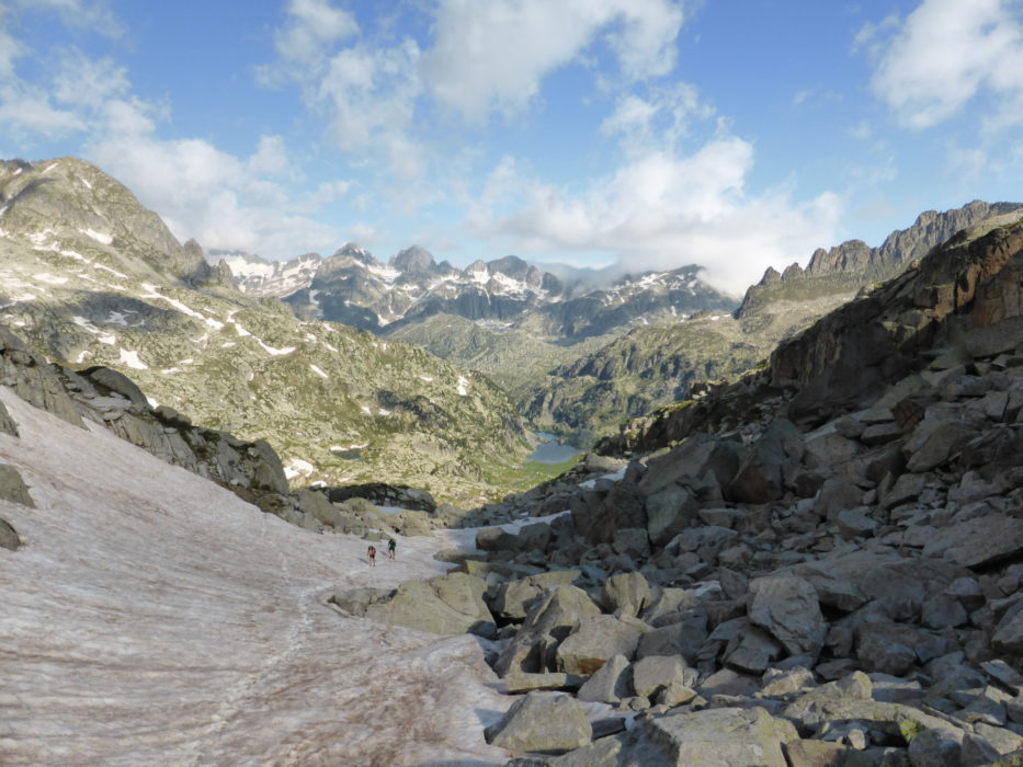 Walkers following the snow track towards the Coll de Contraix