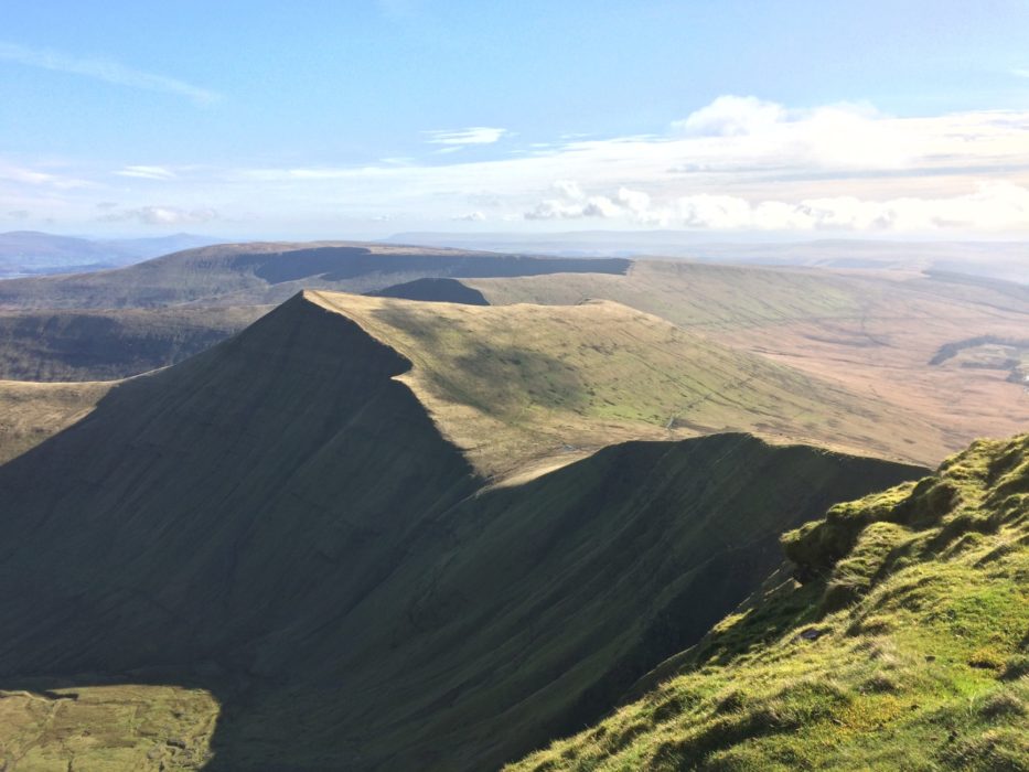 From Pen y Fan the peaks of Cribyn and Fan y Big look like a petrified wave