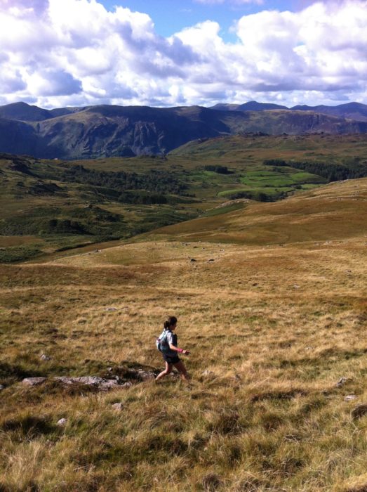 Lily running in the Lakeland fells. Photo by Chris Councell.