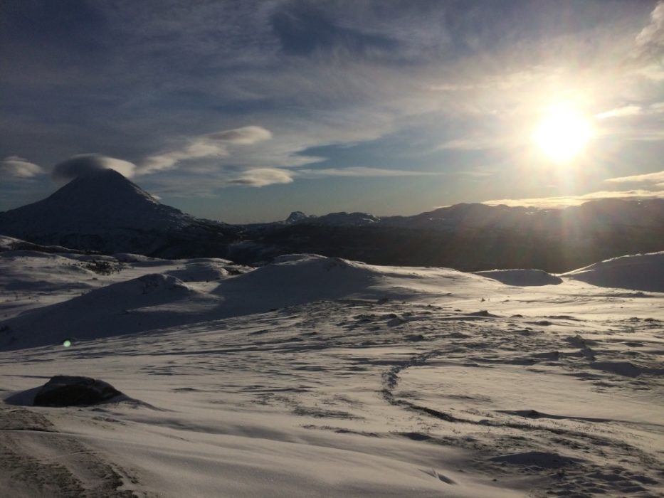 The mid-winter afternoon sun beginning to set over the Telemark plateau and summit of Gaustatoppen (1,883m).