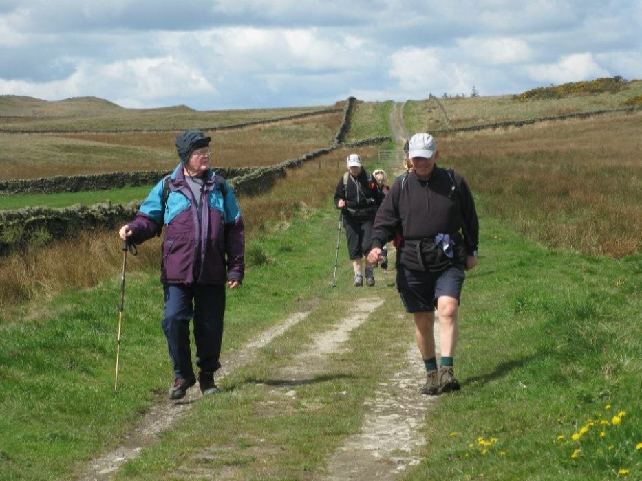 Walkers on the prehistoric track over Skipton Moor