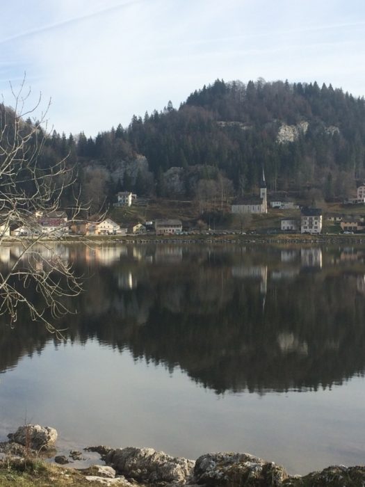 The village of Le Pont, sitting on the shoreline of the highest mountain lake above 1000m in Switzerland, lac du Joux (Stage 11/12)