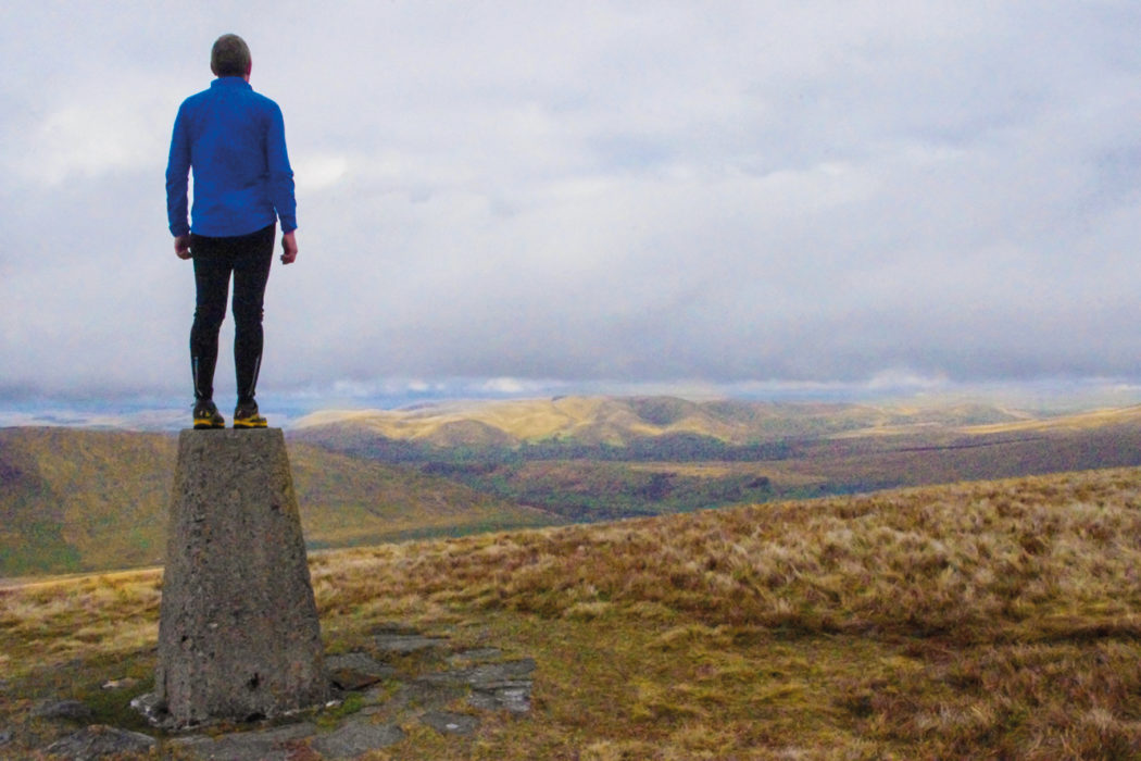 Crag Hill trig point looking north to the Howgills (photo: Adrian Dellbridge)