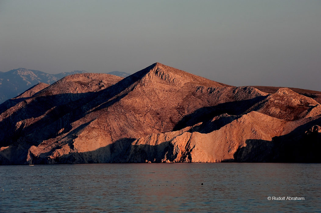 Evening light on the rocky island of Prvić, just off the southern tip of the island of Krk near Baška, Croatia © Rudolf Abraham