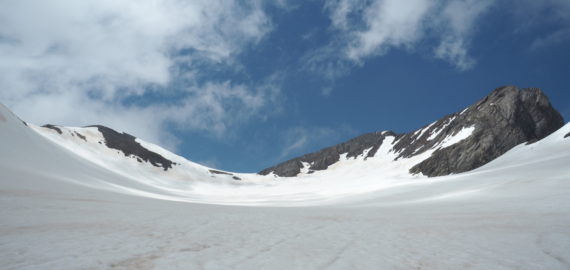 An overview of the Vignemale peak, the Ossoue glacier and the three Russell caves in the middle