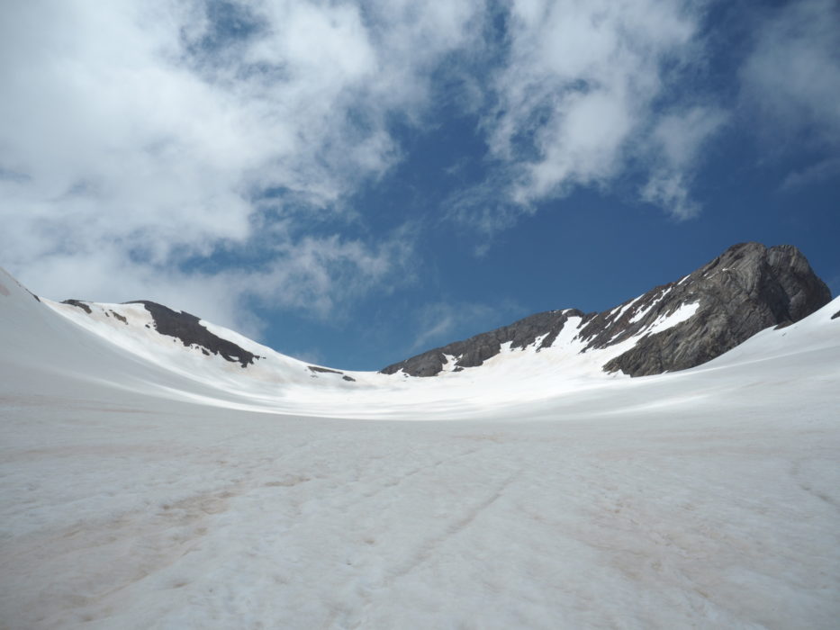 An overview of the Vignemale peak, the Ossoue glacier and the three Russell caves in the middle