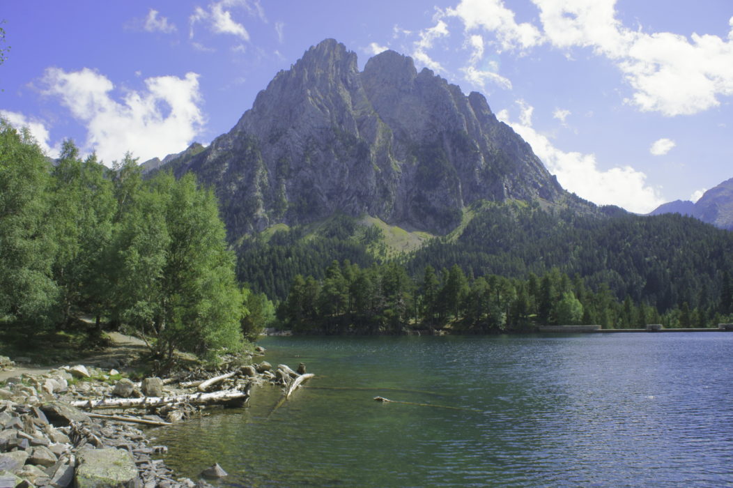 The Encantats peaks rise above the Sant Maurici lake