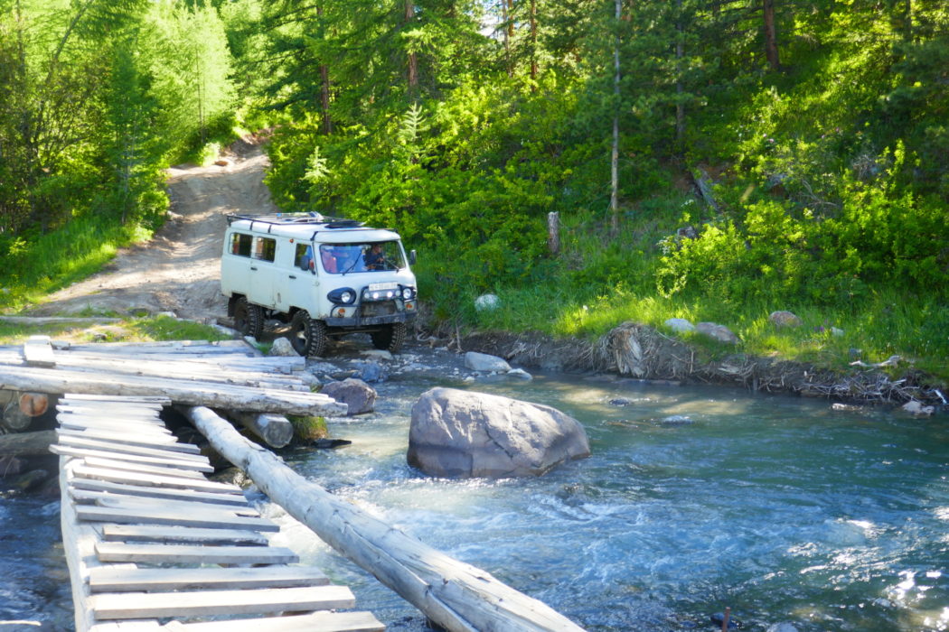 02 Sturdy Uaz Furgon vehicles are used on a rough track to reach the Blue lake trailhead
