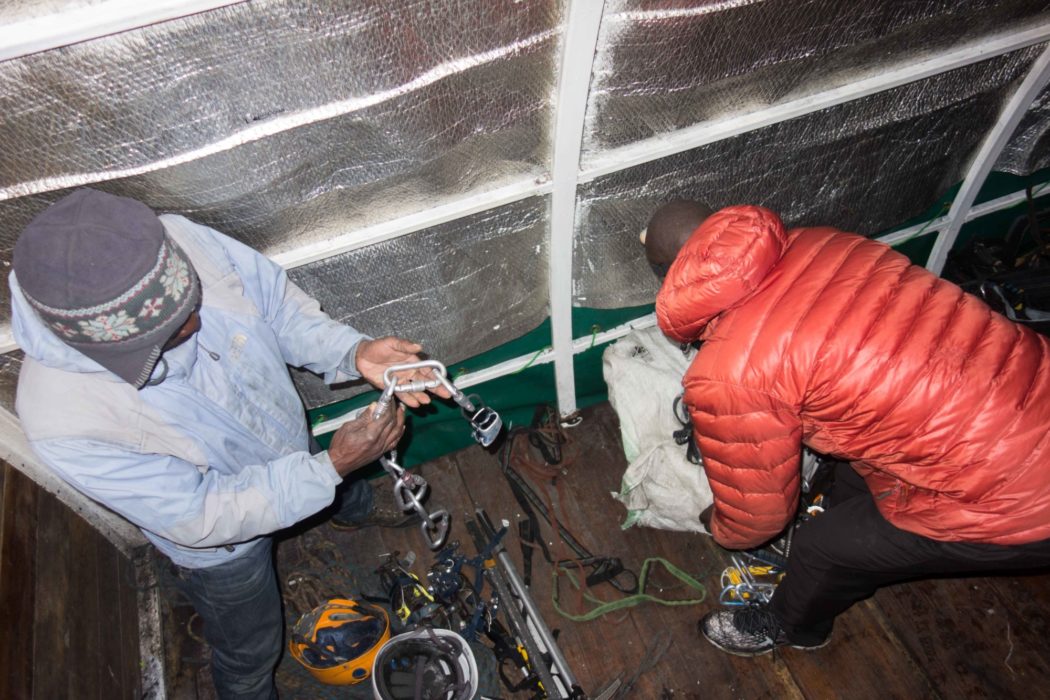 The guides sorting out the mountaineering equipment