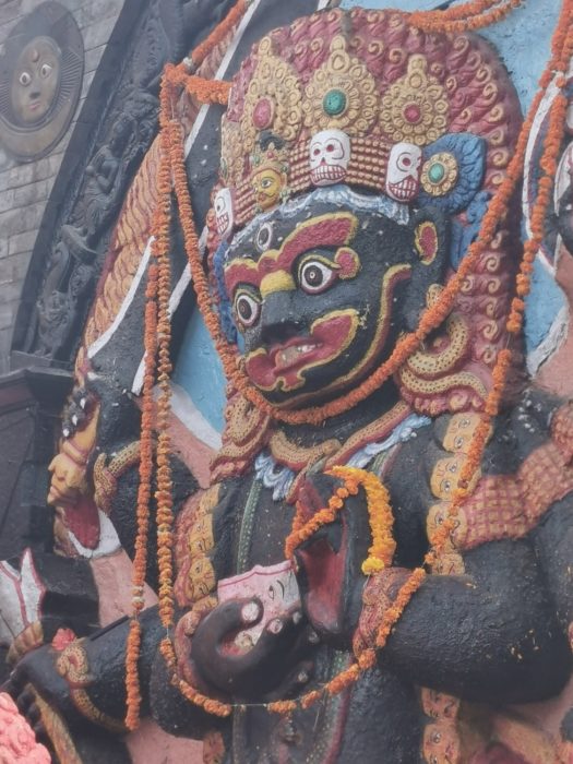 A religious icon decorated with marigold garlands for the festival