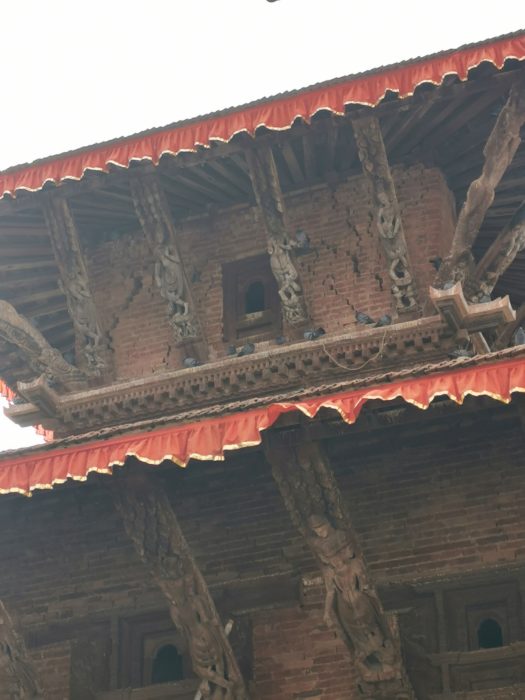 Cracks in the temple buildings. Health and safety doesn't seem to be much of a concern in Nepal and people were enjoying their lunch on the steps underneath this building.