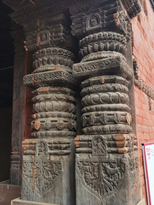 The handcarved detail on the sacred buildings in Durbar Square. Note the pale patches which are recently carved pieces to repair the earthquake damage. An enormous undertaking.