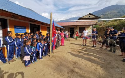 A group photo in front of the finished school
