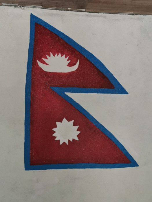 A finished painting of the Nepal flag