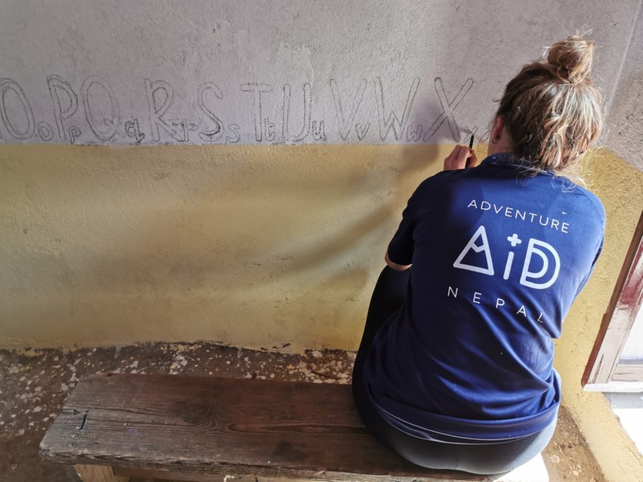 Bethan painting a mural