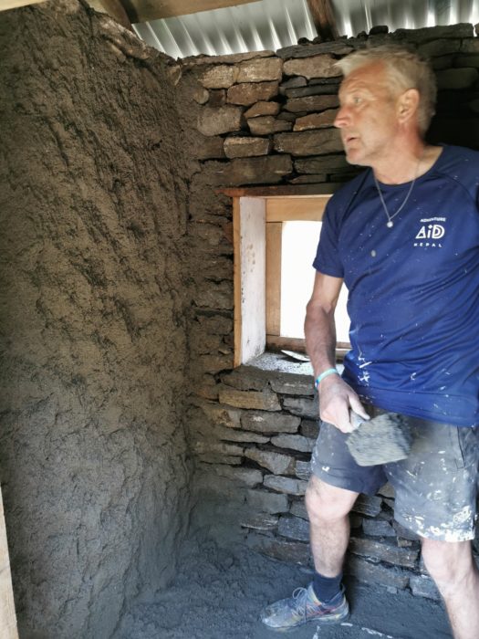 David plastering the walls of the toilet block