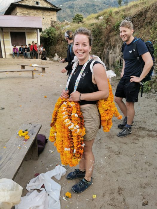 Sarahann prepares to carry our marigold collection back to the campsite - it was quite heavy!