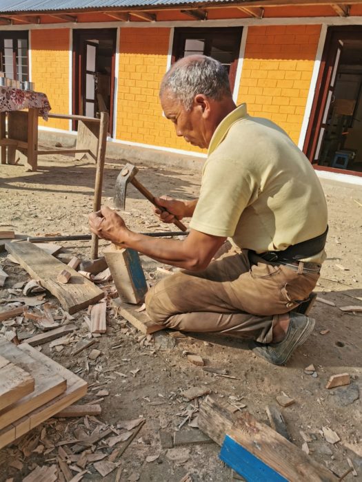 The carpenter making another hammer