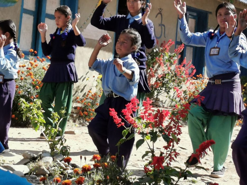 The group of children leading the dance