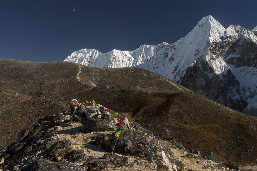 Prayer Flags At The Top Of A Moraine Above Ama Dablam Base Camp At Around 5000M The Scenery Is Dominated By Malanphulan 6573M And Its Impressive North Face