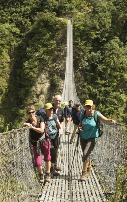 Crossing A Suspension Bridge In Nepal
