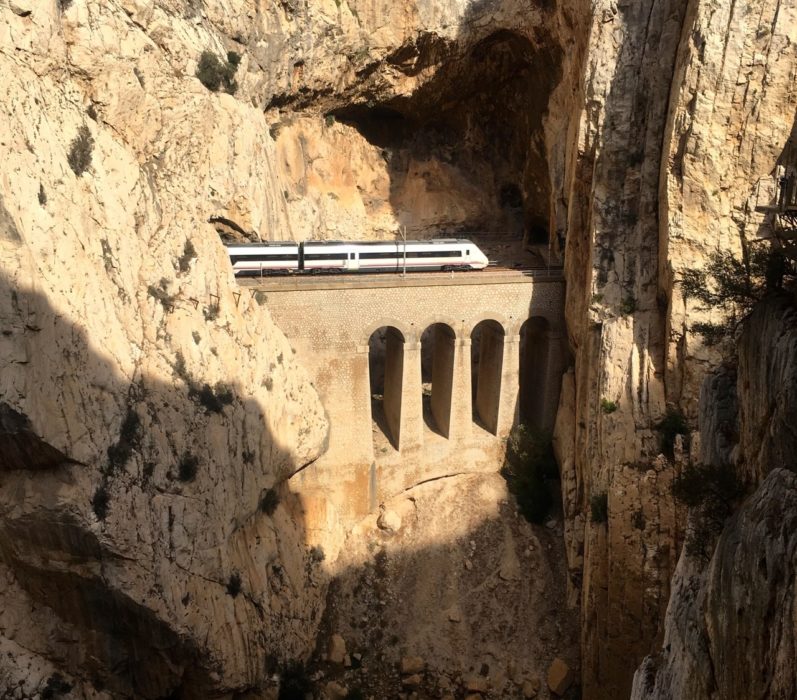 A Train En Route To Malaga Emerges Briefly From The Mountain