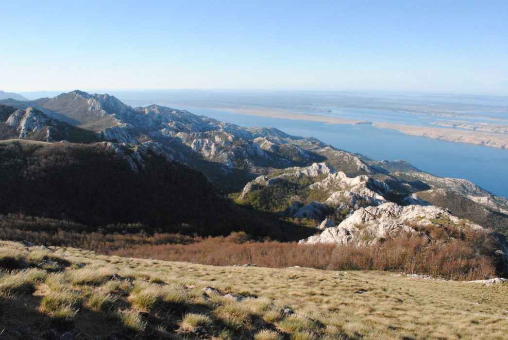 The Mountains Tumble Into The Sea In The Early Morning Sun